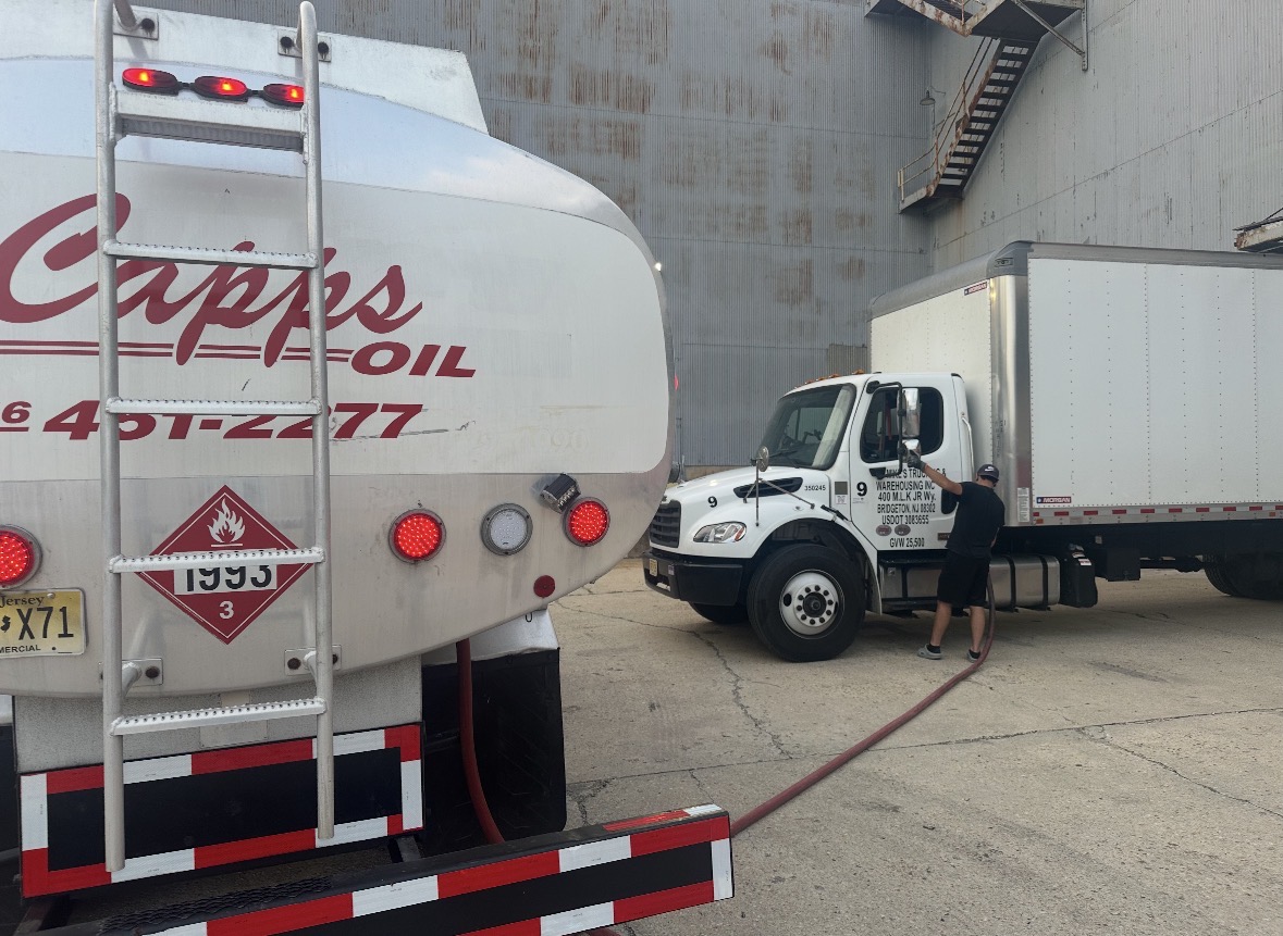 Tim Capps Oil Co. driver fueling a truck at a Bridgeton warehouse